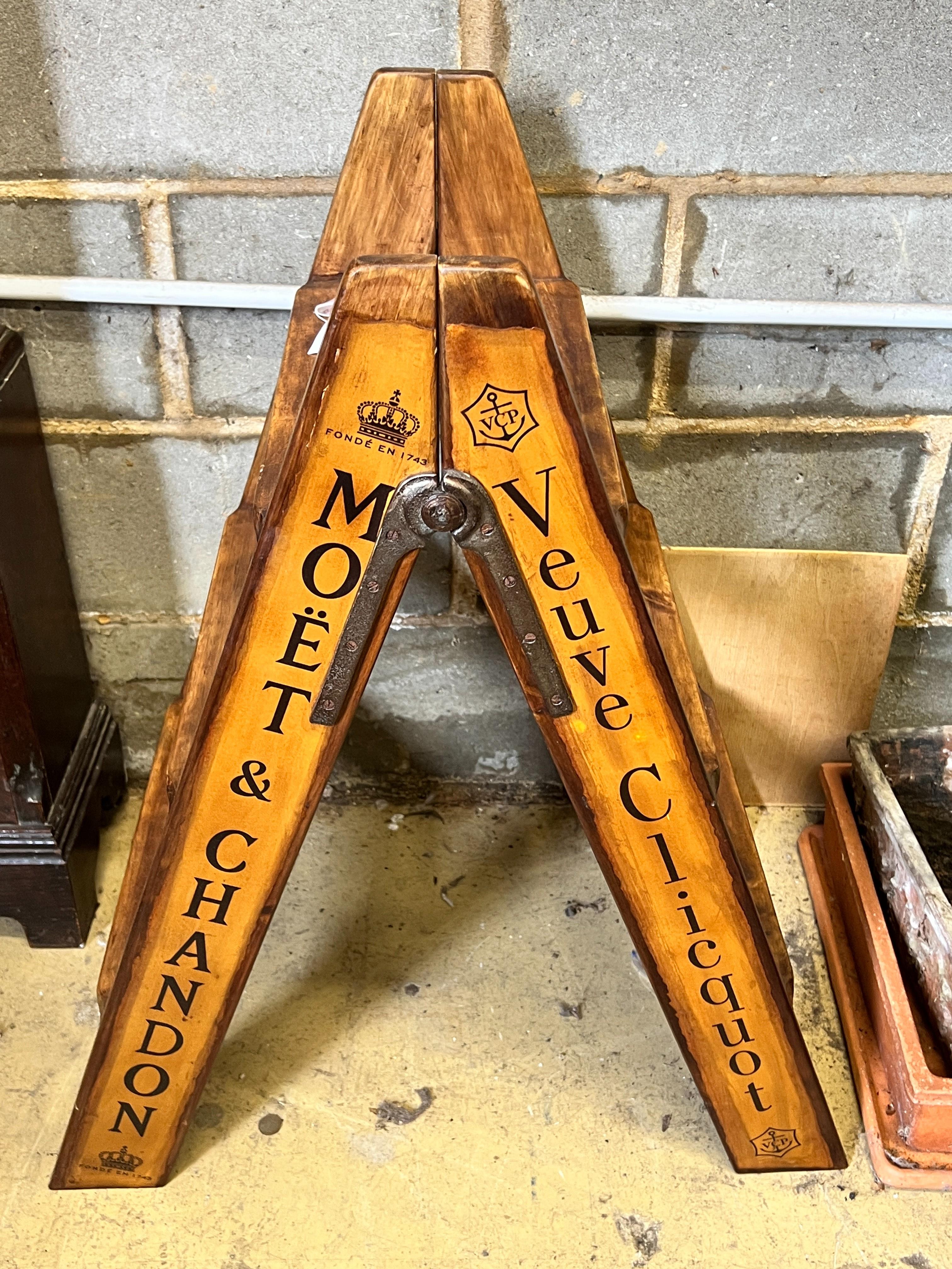 A pair of vintage style walnut folding cellar steps painted with champagne brands